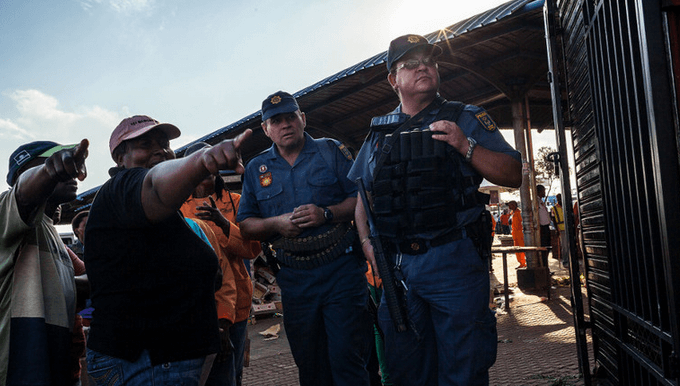 Police raiding foreign shopkeepers