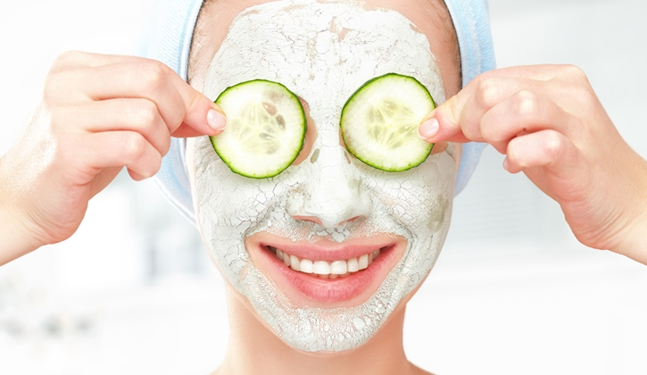 The image shows a lady doing a facial routine