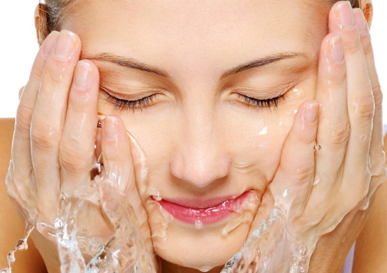 the image shows a lady washing your face